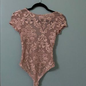 Light pink body suit